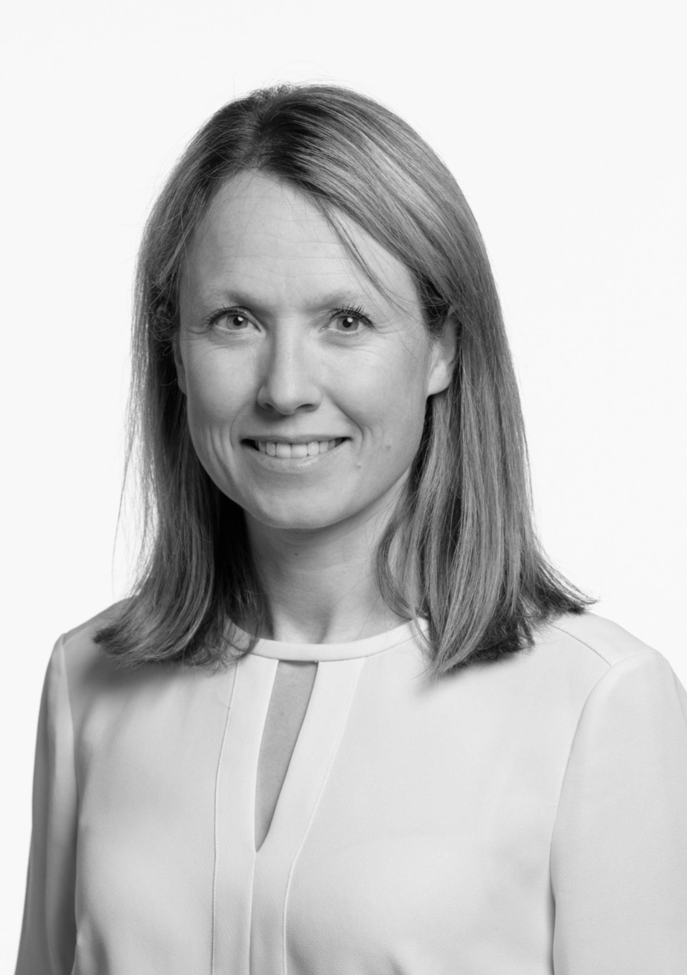 A woman looking into the camera and smiling