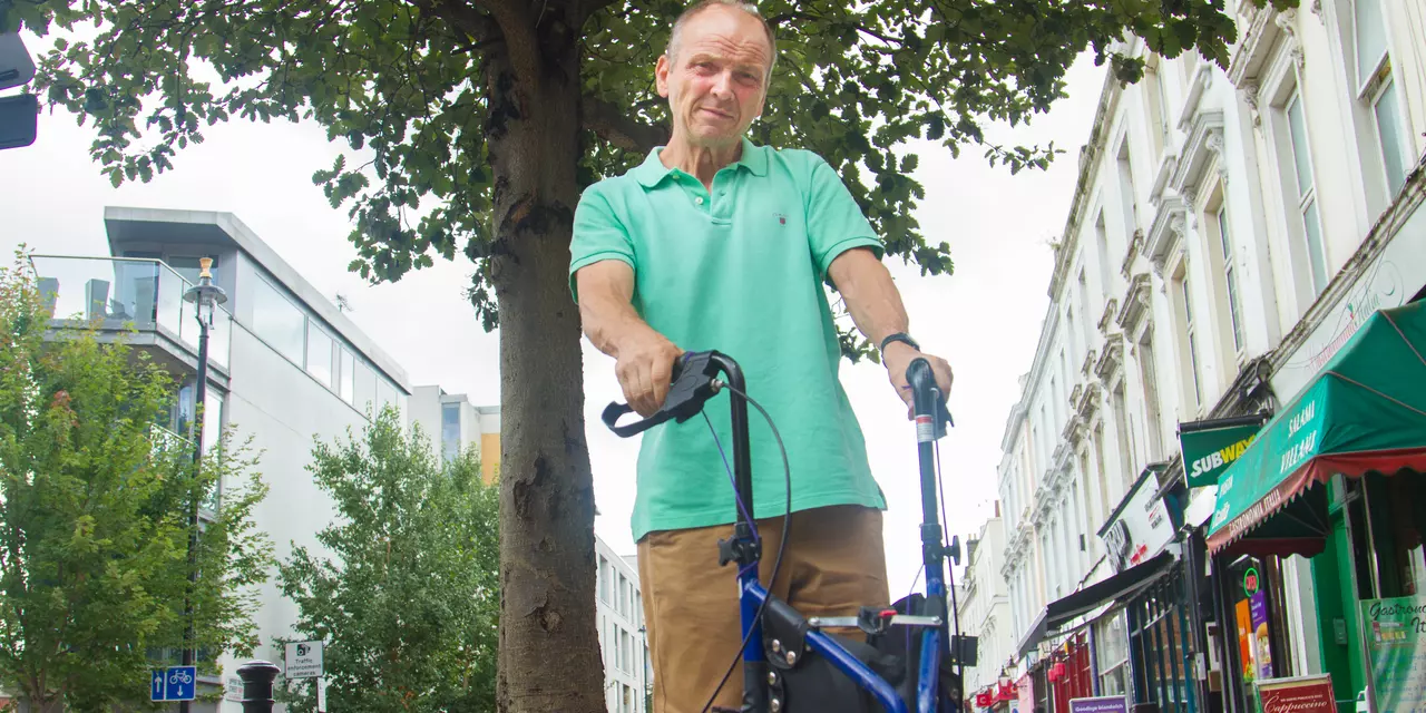 Bob, who has dyskinesia, with his walking aid.