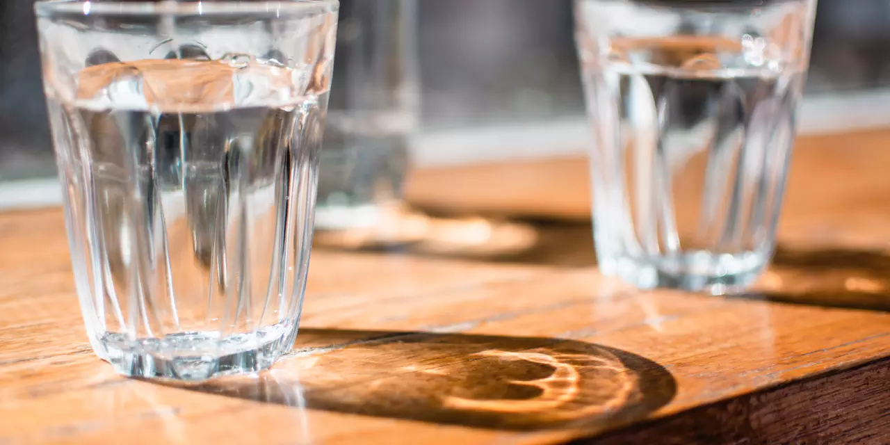 Three glasses of water on a table