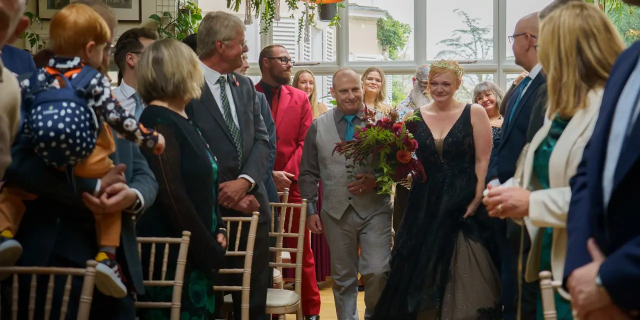 Paul walks his daughter down the aisle