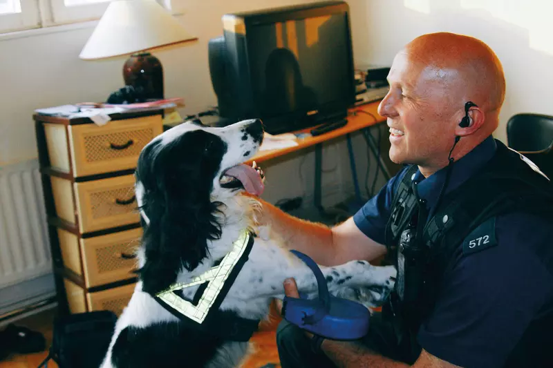 Paul Nicholls with police detection dog