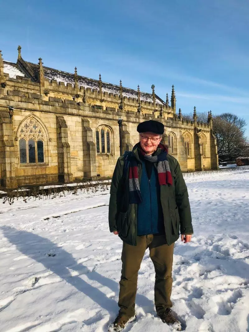 Mark in the snow outside a church