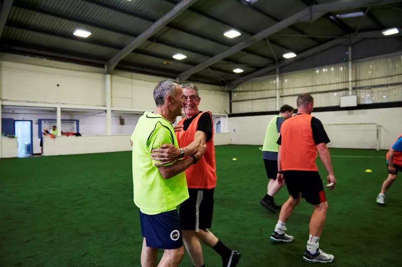 John who has Parkinson's, playing football in the We Are Undefeatable campaign