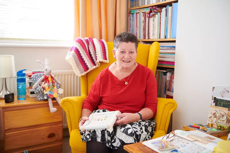 Mariette sat with sewing on her lap