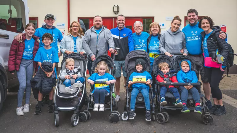 Large group of walkers in Parkinson's UK t-shirts