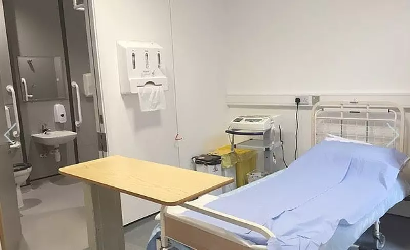 Example of a ward at the research site including a bed, table and bathroom