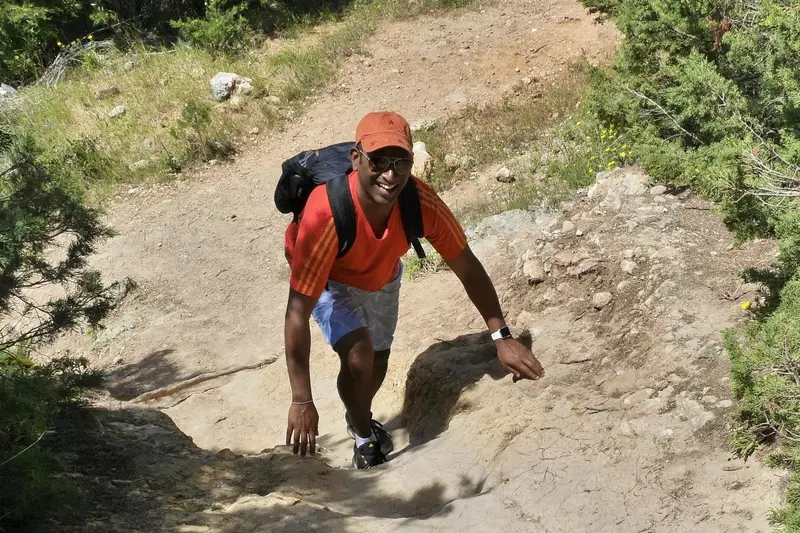 Kuhan Pushparatnam climbing a hill