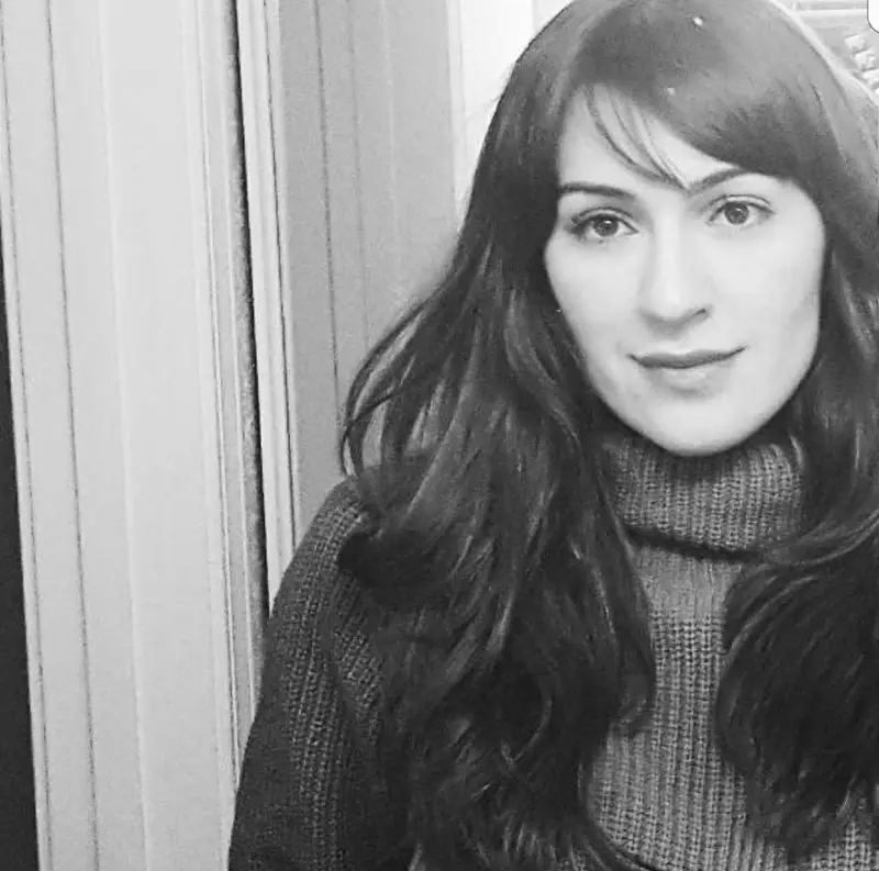 A black and white photo of Kali Barawi, a researcher at Cardiff University