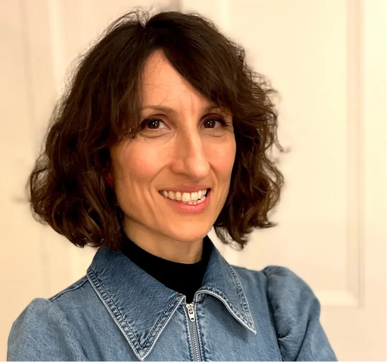 A headshot of Dr Petra Priotsi. Petra is wearing a denim shirt