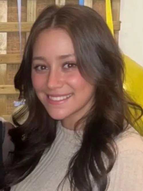 Georgia Mills wearing a white jumper