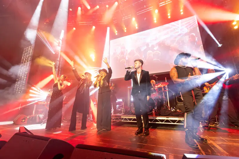 Performers on the stage of Parkinson's UK Present: a night at the Roundhouse