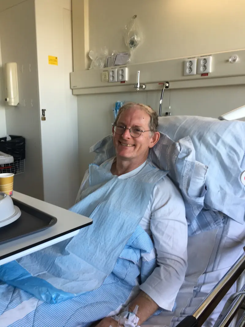 Andy sitting in a hospital bed after having his stem cell transplant as part of the STEM-PD research trial