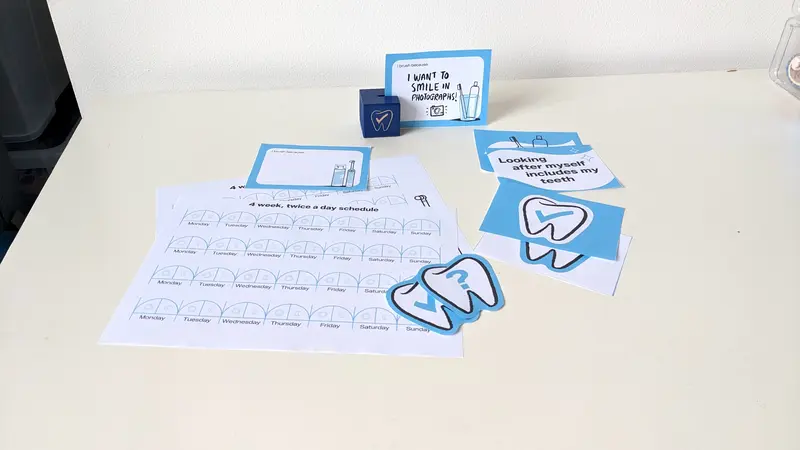 Paper cut outs and parts of the workbook that Mick and Jessie have been working on to improve oral health in Parkinson's. Photo provided by Studio Noodle